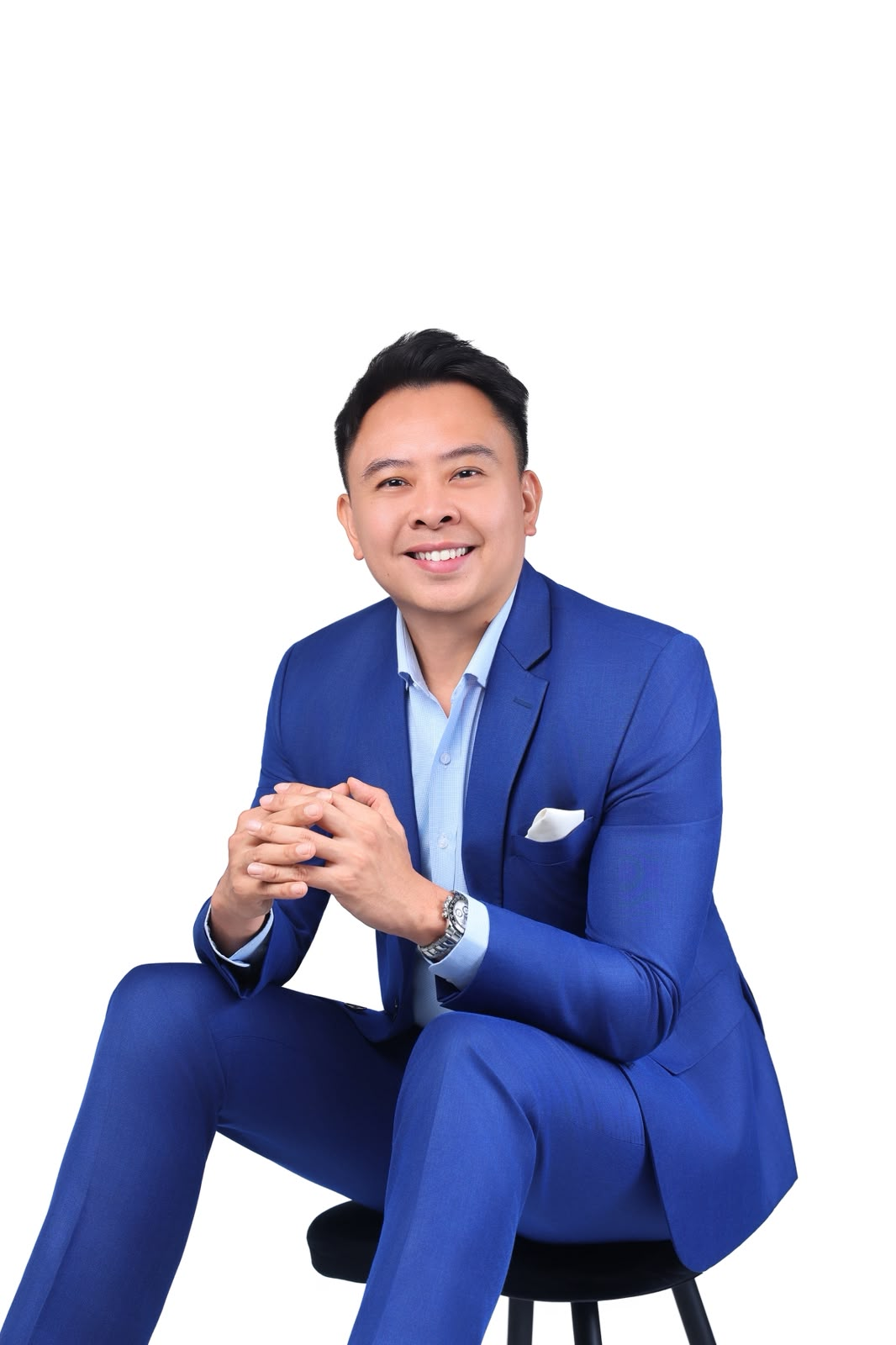 Prestige Wealth representative seated in a blue suit